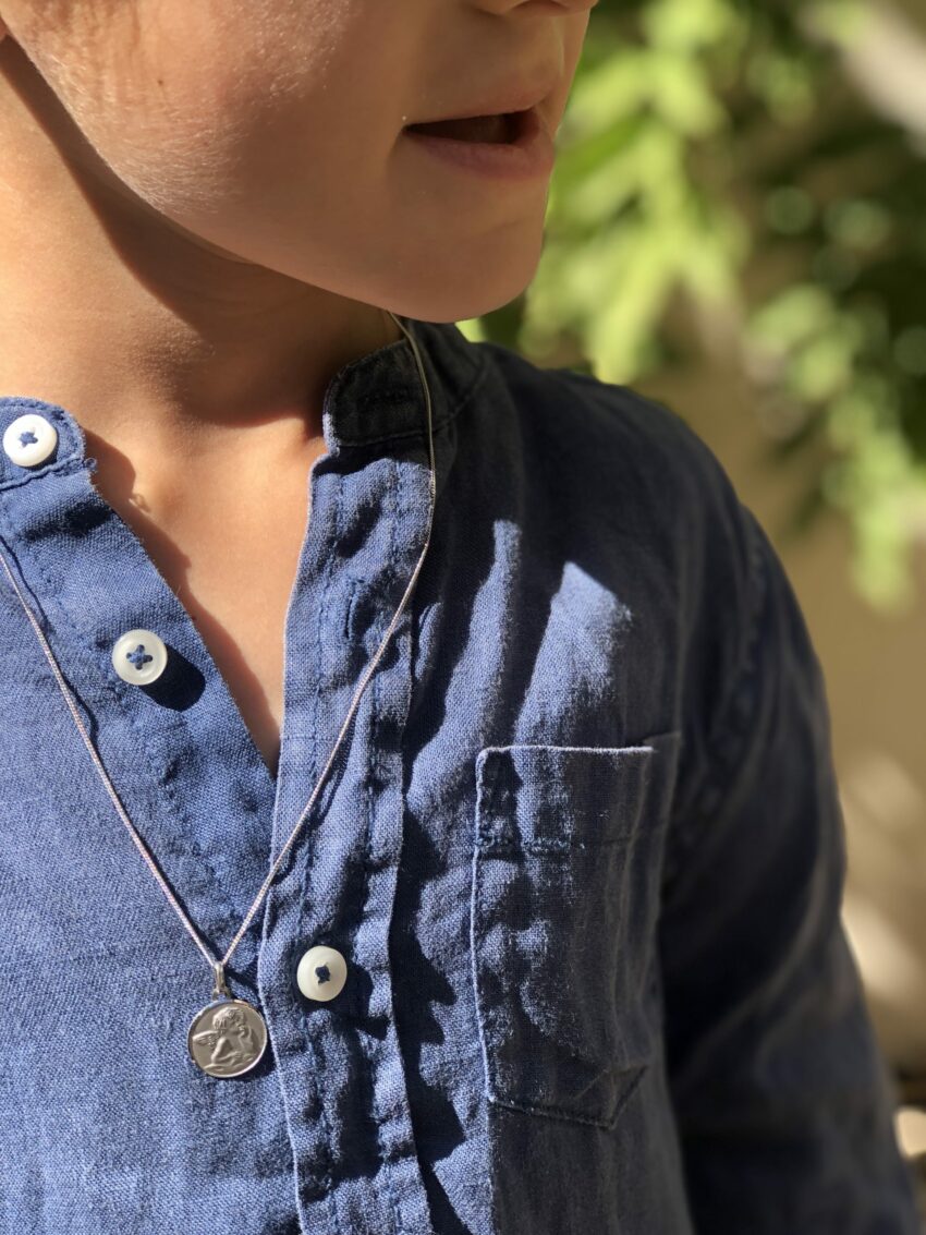 médaille en or blanc